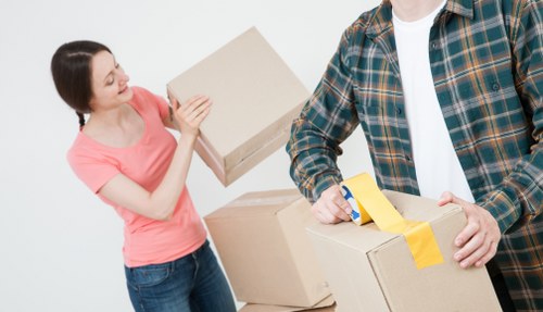 Loading furniture into a removals van in Harold Wood