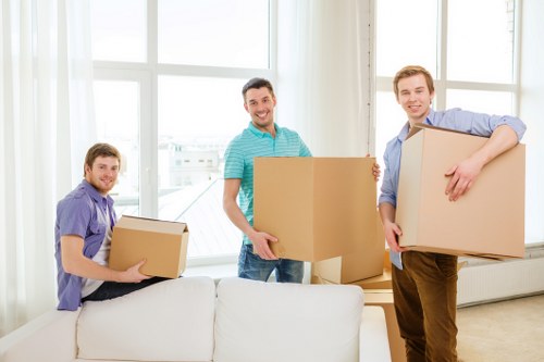 Packed office furniture and labelled boxes ready for relocation