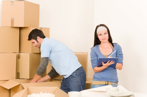 Careful loading of household items into a removal van