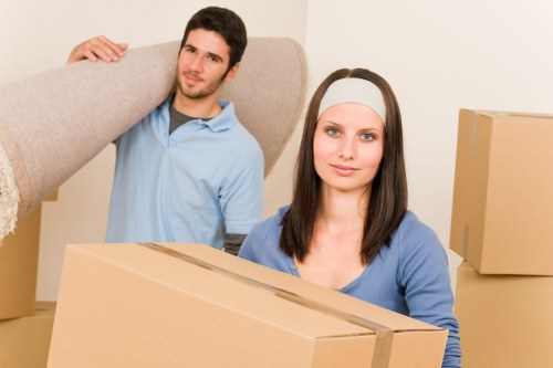 Packed boxes and furniture prepared for transport in Harold Wood
