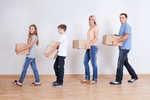 Packed boxes and furniture ready for local moving day