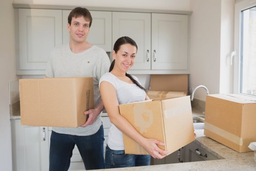 Packed moving boxes and furniture ready for removals service